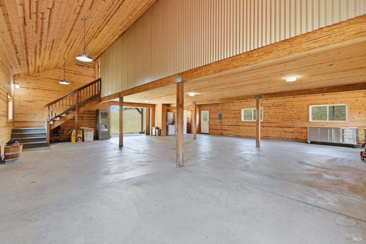 3223 Canfield Road Sebastopol, CA 95472 - Photo 49 of 58 Interior of Barn with Stairwell to Apartment