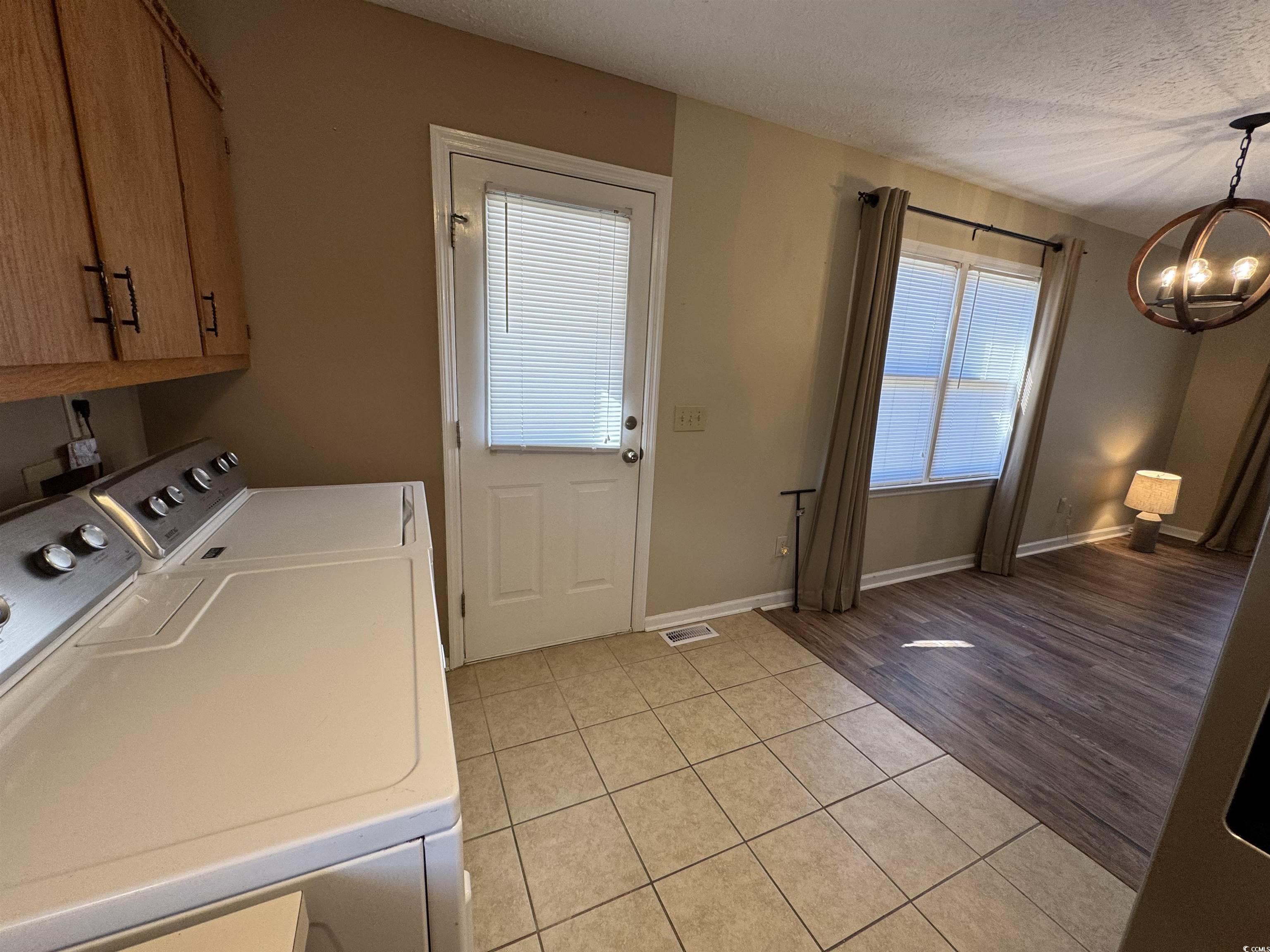 1014 Holt Road Conway, SC 29526 - Photo 13 of 23 Laundry room with cabinets, an inviting chandelier