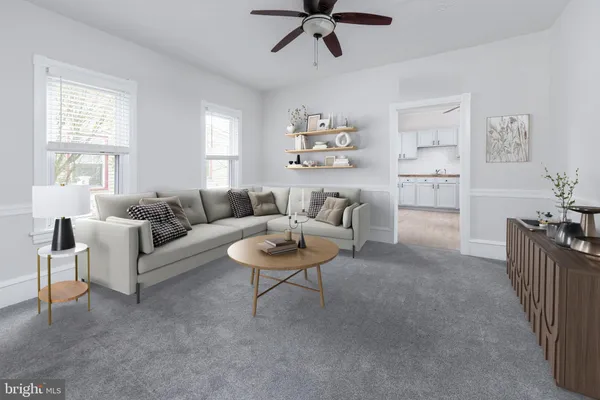 a living room with furniture and a window