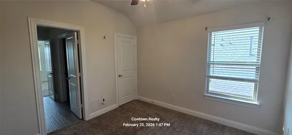 a view of an empty room with a window