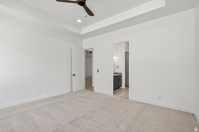 2862 South Mountain Rnch Road Cedar City, UT 84720 - Photo 23 of 64 Carpeted room featuring a tray ceiling with a ceiling fan and recessed lighting