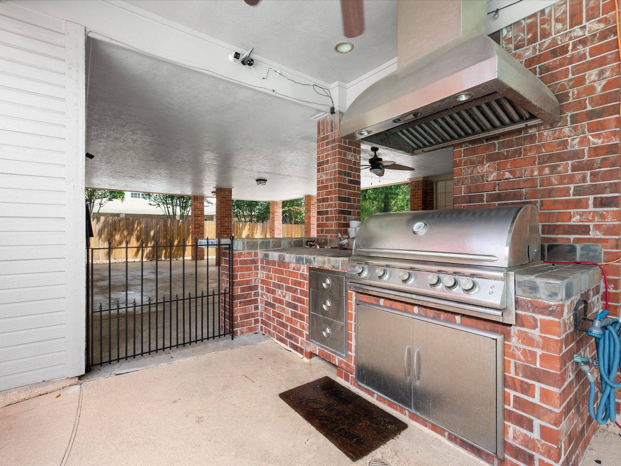 16123 Lafone Drive Spring, TX 77379 - Photo 37 of 47 The outdoor kitchen makes entertaining effortless, allowing you to prepare meals and serve guests while enjoying the beauty of the surrounding outdoor spaces.