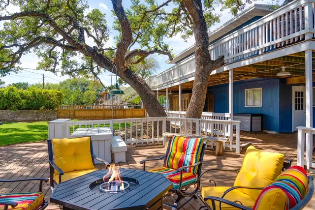 an aerial view of a house with a yard and lake view