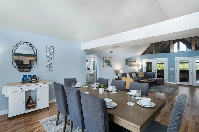 a living room with furniture and garden view