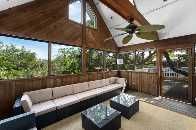 a view of a patio with couches and a table and chairs