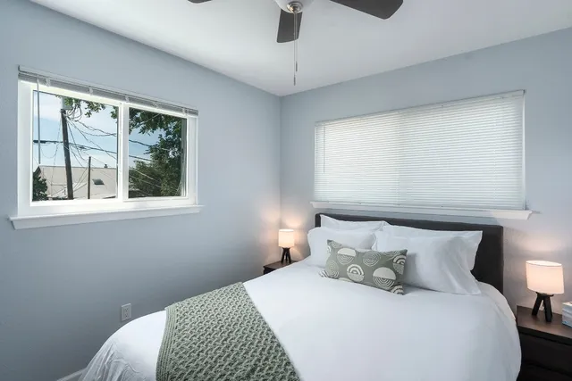 a room with a flat screen tv and a window