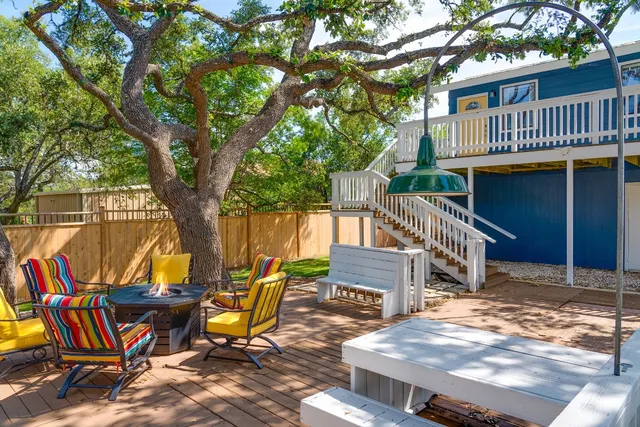 a view of a chairs and table in the deck