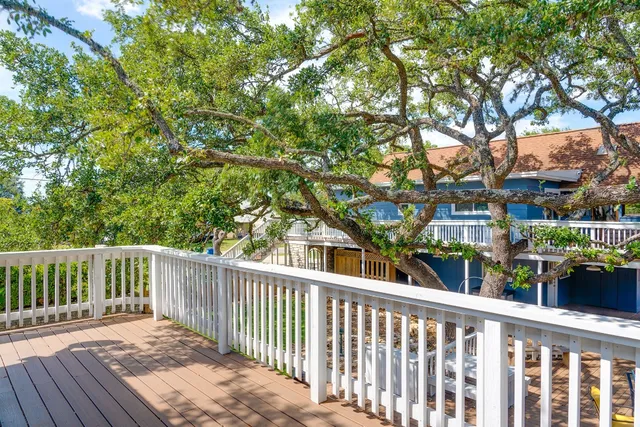 a front view of a house with a yard garage and outdoor seating