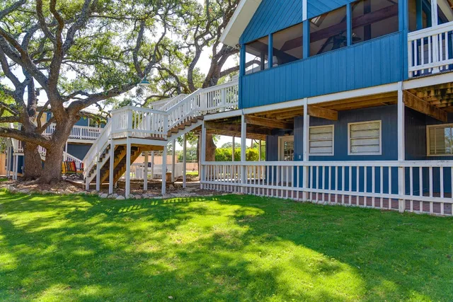 a view of a balcony with wooden floor