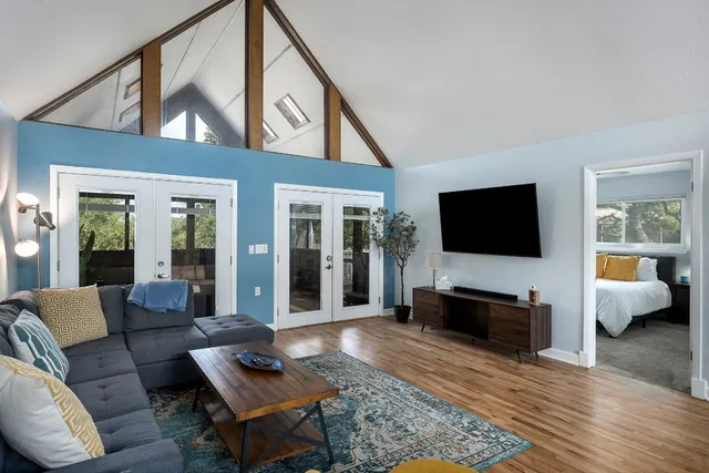 a living room with furniture and a rug