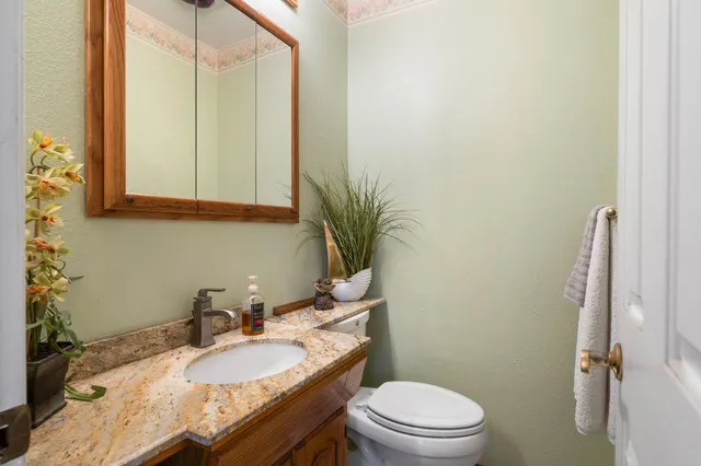 a bedroom with a bed and a plant