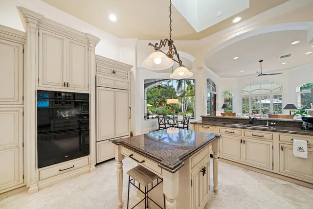 a view of a house with backyard sitting area and garden