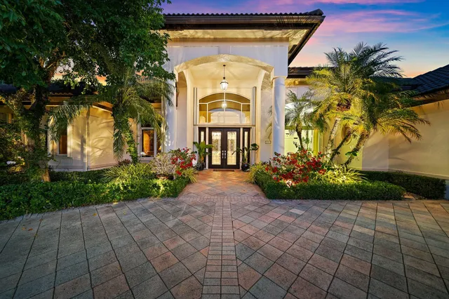 an aerial view of a residential houses with outdoor space and street view
