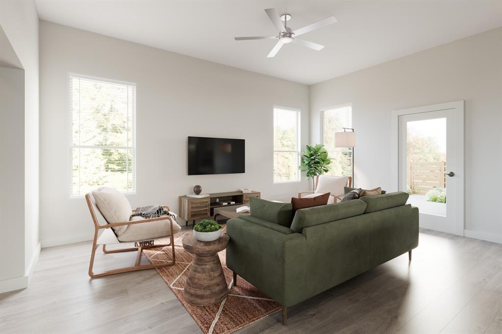 3007 Canvas Way Anna, TX 75409 - Photo 2 of 21 a living room with furniture and a flat screen tv