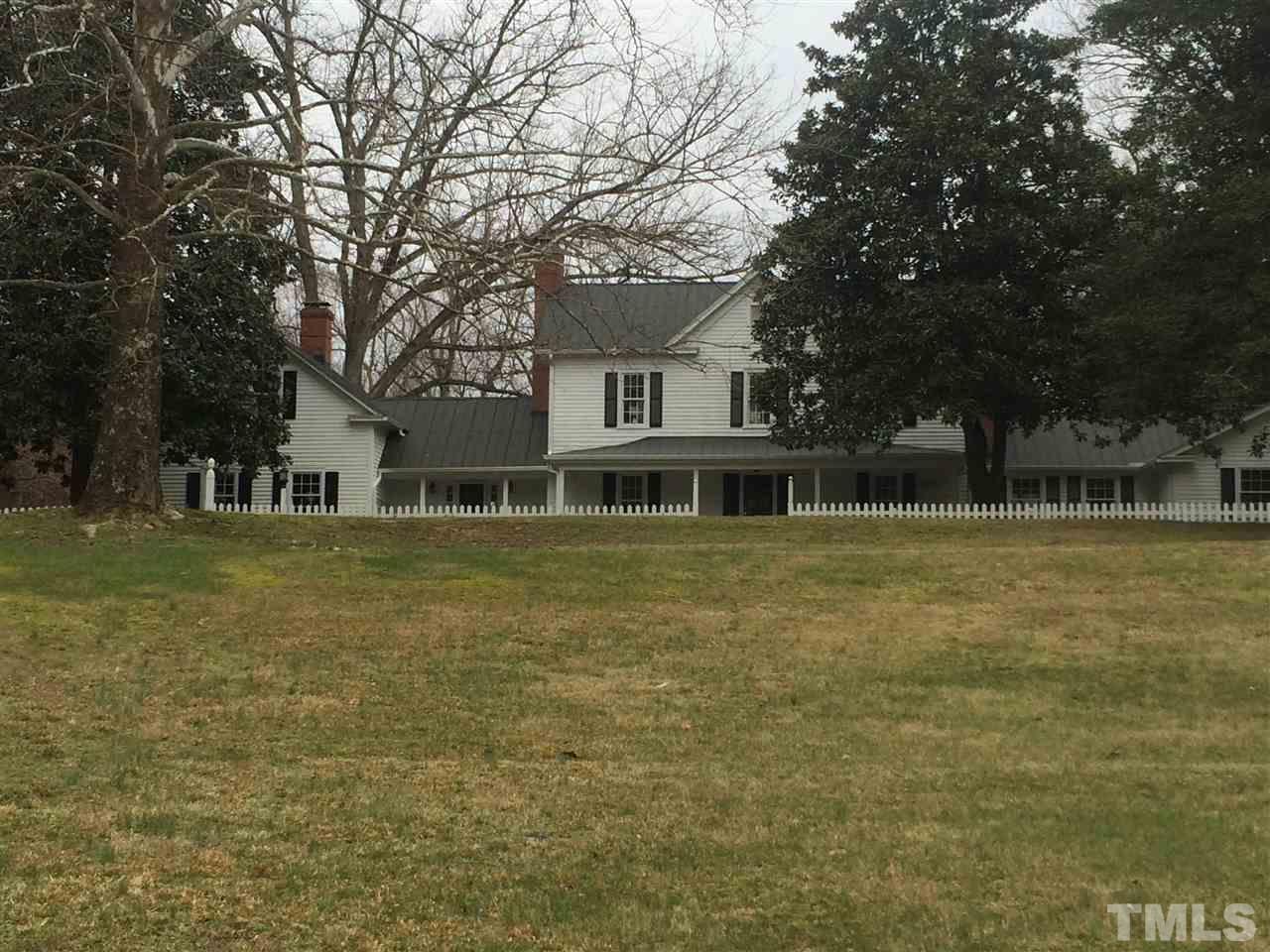1188 Old Lystra Road Chapel Hill, NC 27517 - Photo 14 of 15 a front view of a house with a garden