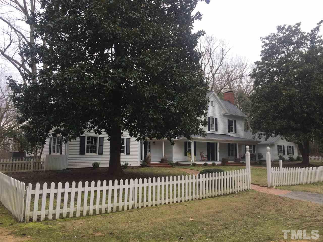 1188 Old Lystra Road Chapel Hill, NC 27517 - Photo 15 of 15 a front view of a house with a garden