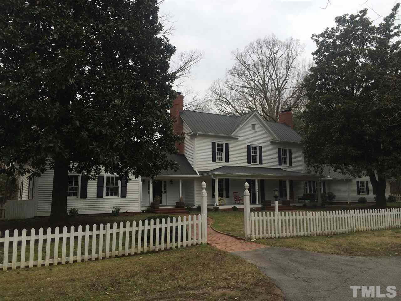 1188 Old Lystra Road Chapel Hill, NC 27517 - Photo 4 of 15 a front view of a house with a garden