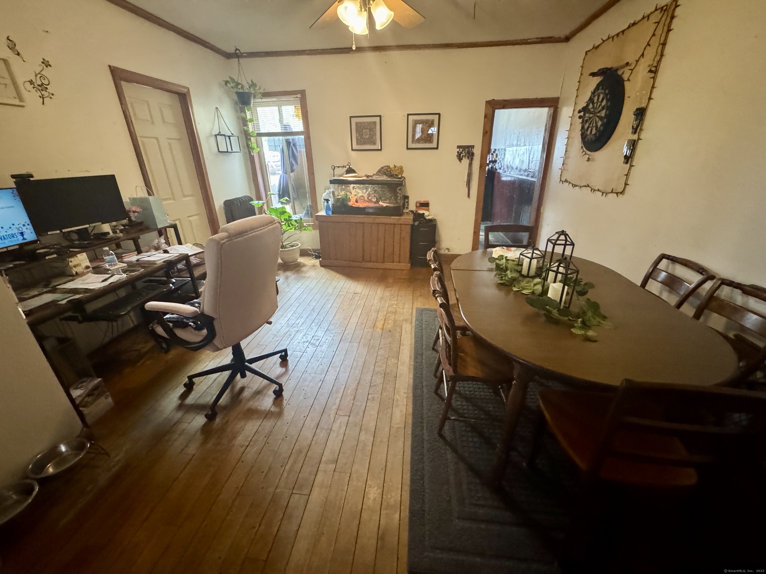44-46 South Chestnut Street Plainfield, CT 06387 - Photo 13 of 40 a view of a dining room with furniture and wooden floor
