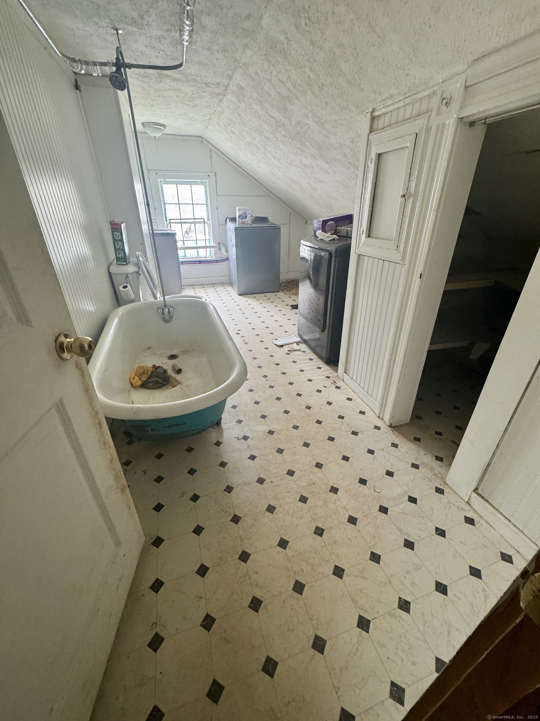 44-46 South Chestnut Street Plainfield, CT 06387 - Photo 27 of 40 a bathroom with a sink a toilet a mirror and shower