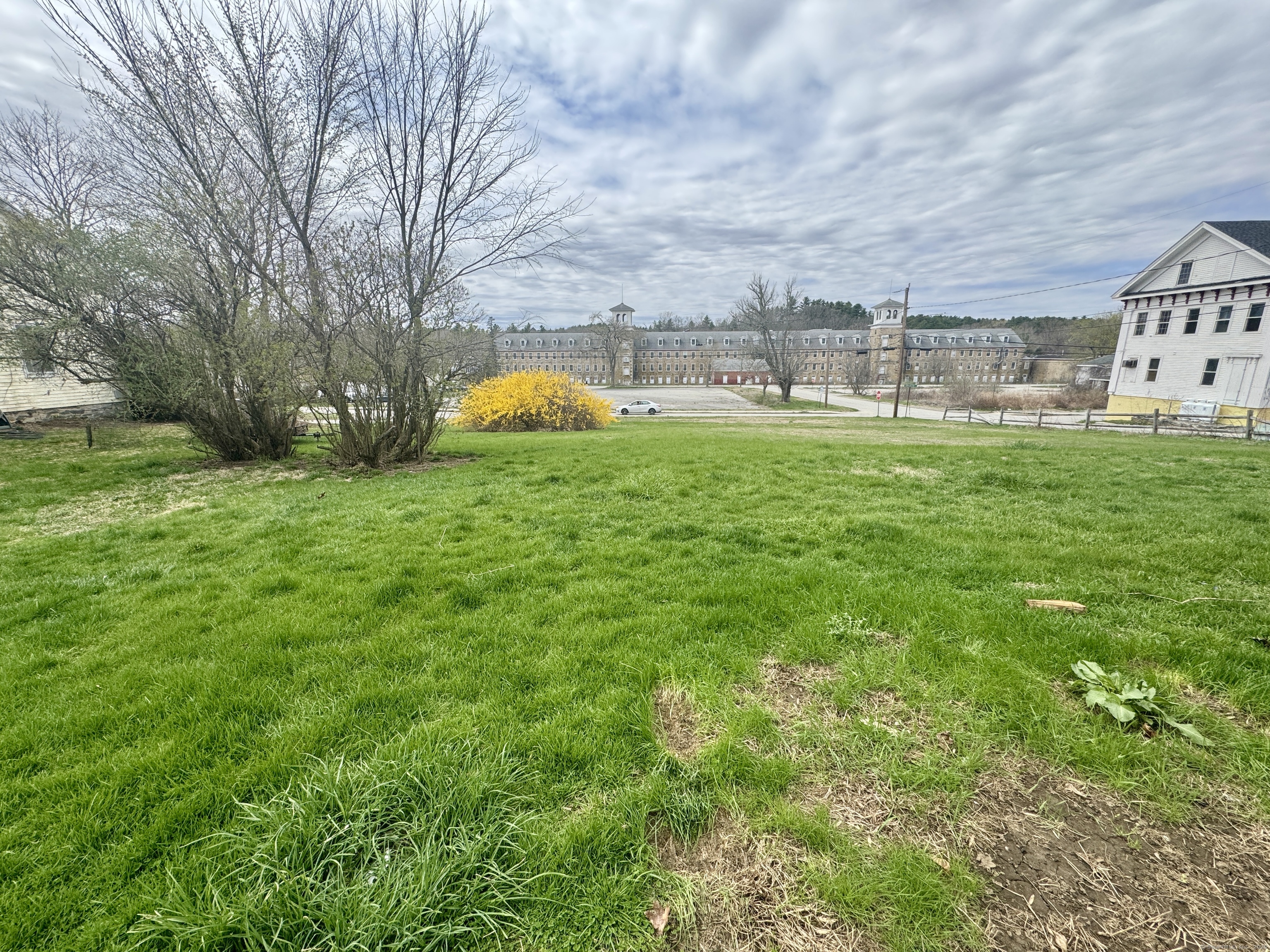44-46 South Chestnut Street Plainfield, CT 06387 - Photo 3 of 40 a backyard of a house with lots of green space and fountain