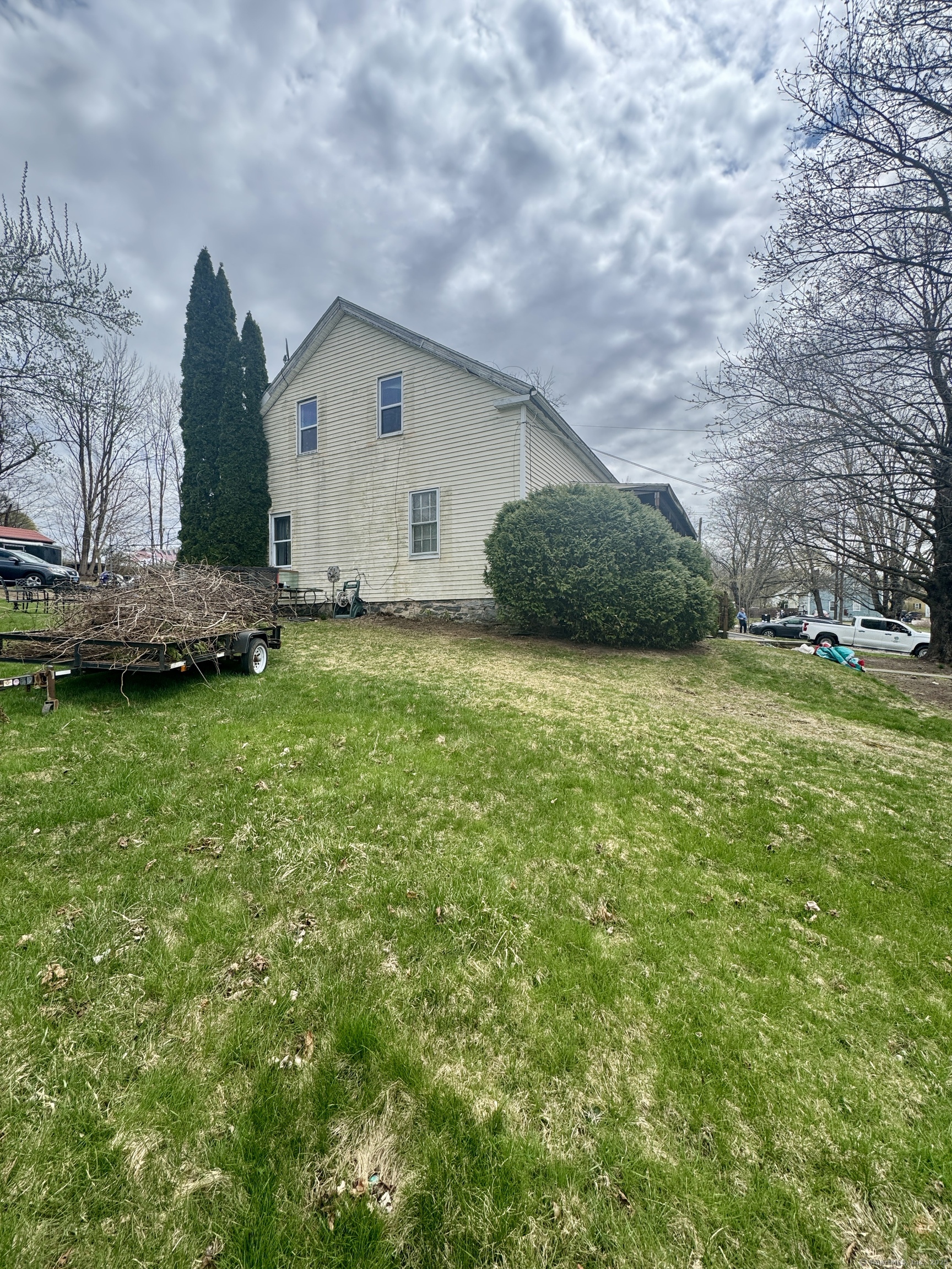 44-46 South Chestnut Street Plainfield, CT 06387 - Photo 4 of 40 a view of a house with a yard and garage