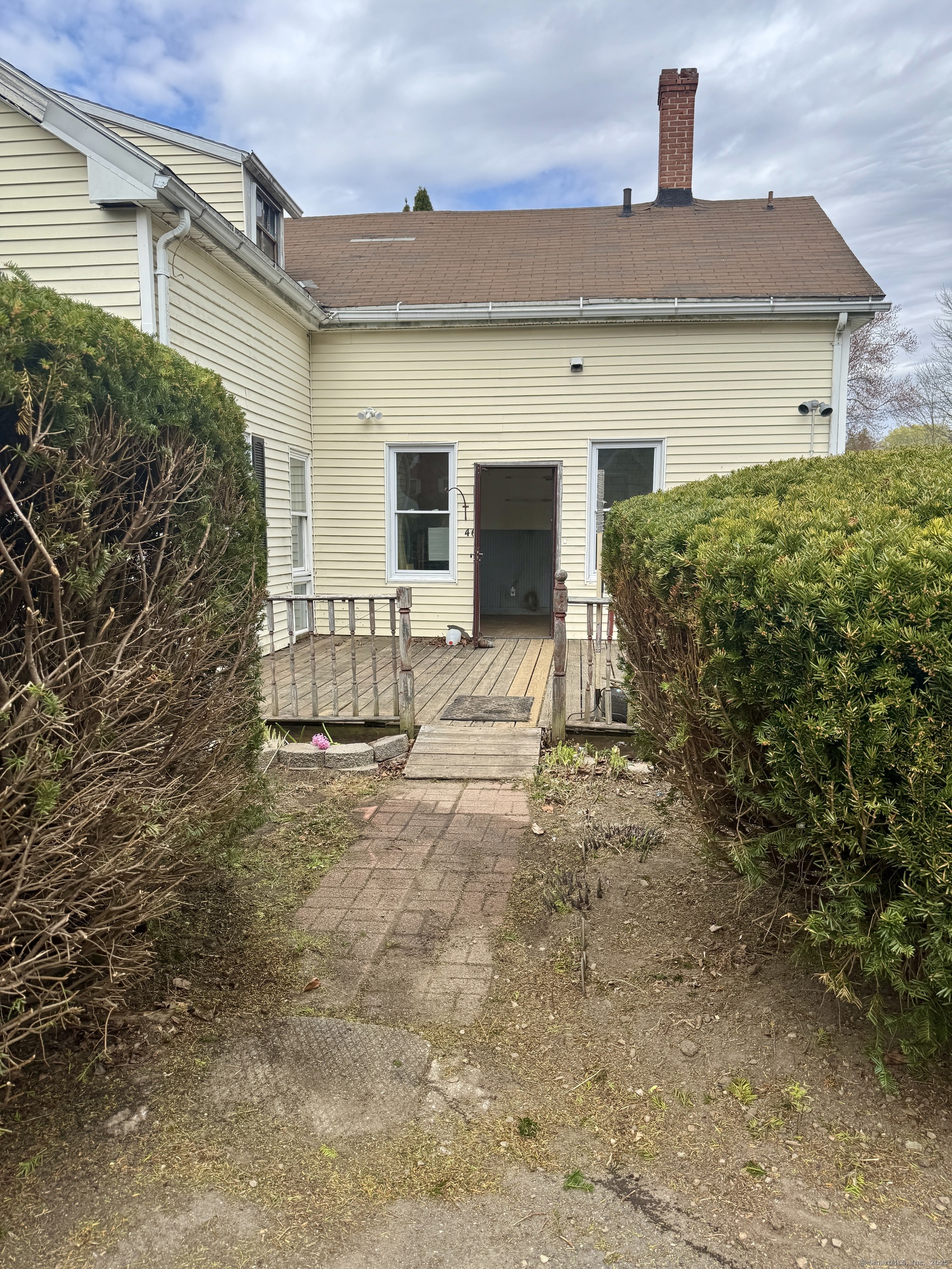 44-46 South Chestnut Street Plainfield, CT 06387 - Photo 9 of 40 a view of house with backyard and glass windows