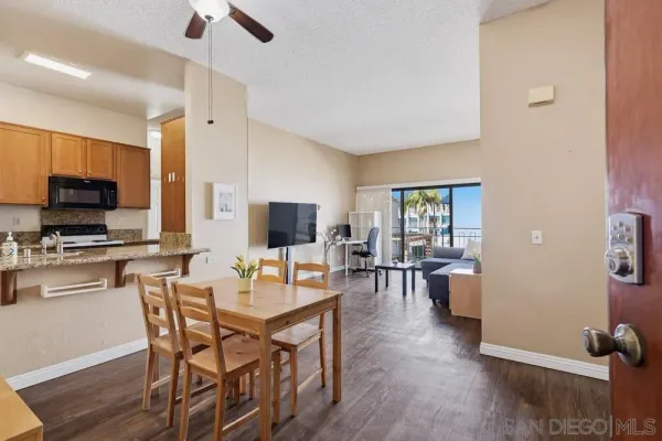 a view of a dining room with furniture window and wooden floor