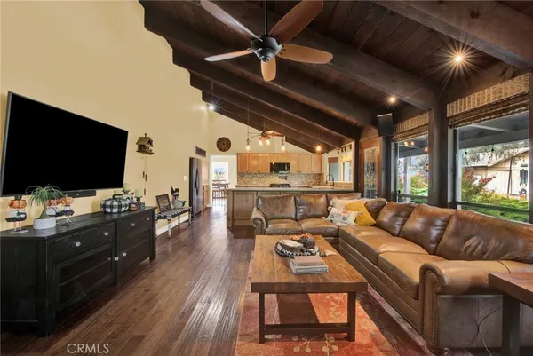 a living room with furniture and fireplace