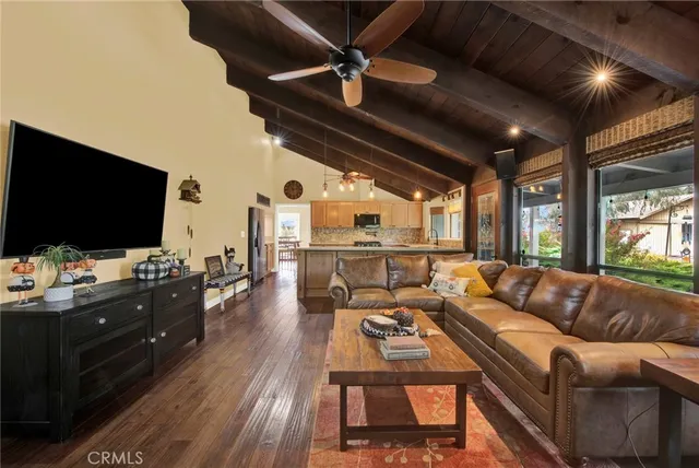 a living room with furniture and fireplace