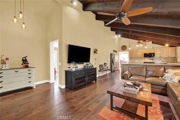 a large white kitchen with a large window