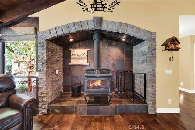 a large kitchen with a large window and stainless steel appliances
