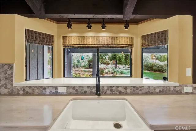 a bathroom with a sink and mirror