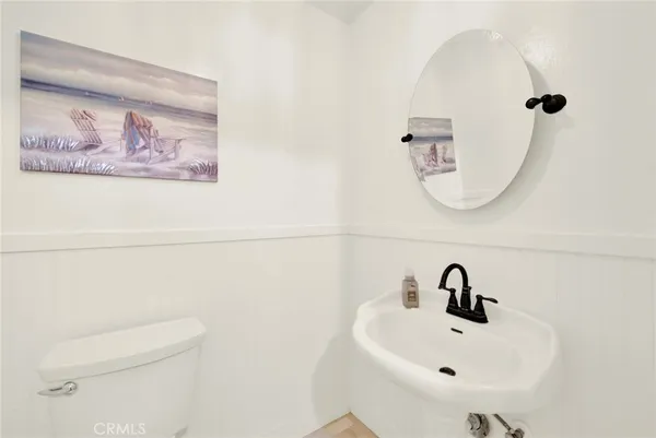 a bedroom with a bed couch and a ceiling fan