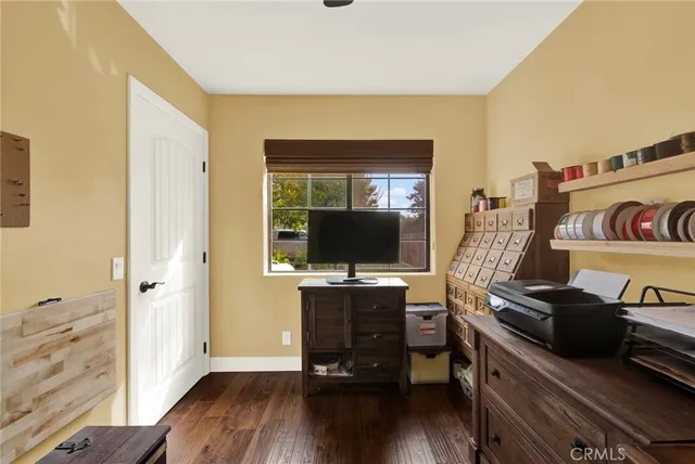 a bedroom with a bed and a table in it