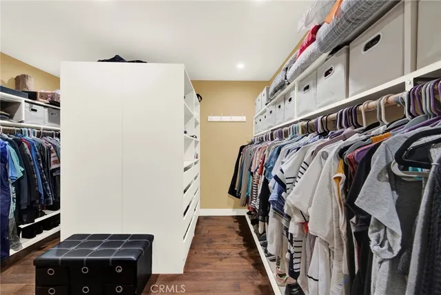 a view of a patio with couches chairs potted plants and a big yard