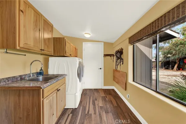 a view of a patio with a table and chairs