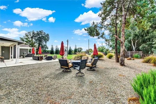 a view of a house with a outdoor space and parking
