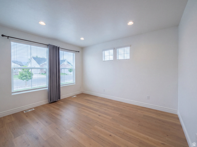 1251 North 2525 West Clinton, UT 84015 - Photo 12 of 30 Bright room featuring wood-finish flooring and recessed ceiling lights