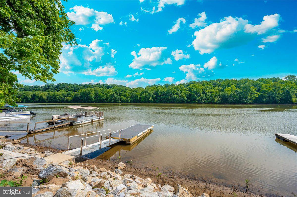 9 Boo Boo Boulevard Falling Waters, WV 25419 - Photo 16 of 40 a view of a lake with outdoor space