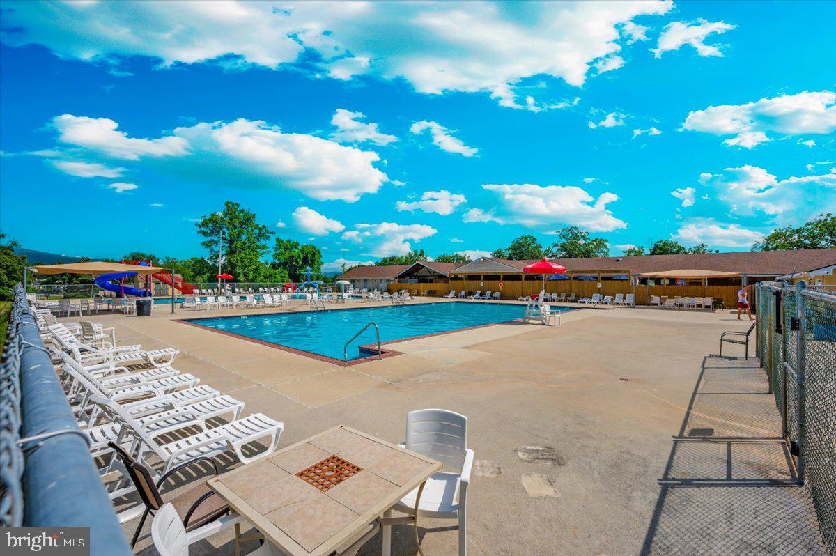 9 Boo Boo Boulevard Falling Waters, WV 25419 - Photo 24 of 40 a view of swimming pool with outdoor seating