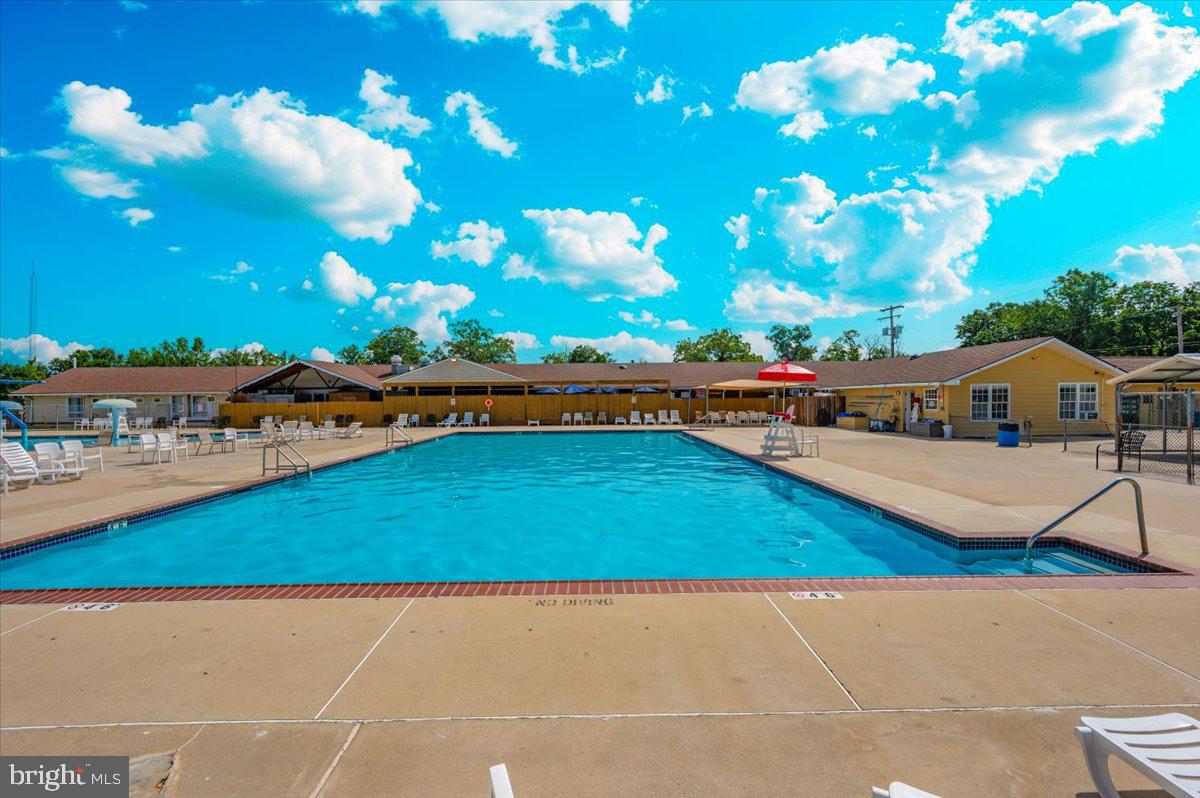 9 Boo Boo Boulevard Falling Waters, WV 25419 - Photo 25 of 40 a view of swimming pool and outdoor seating