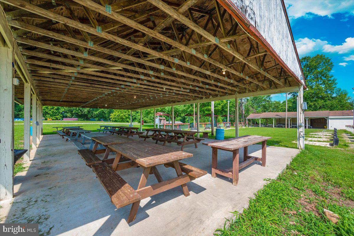 9 Boo Boo Boulevard Falling Waters, WV 25419 - Photo 32 of 40 a view of a backyard with sitting area furniture and a backyard