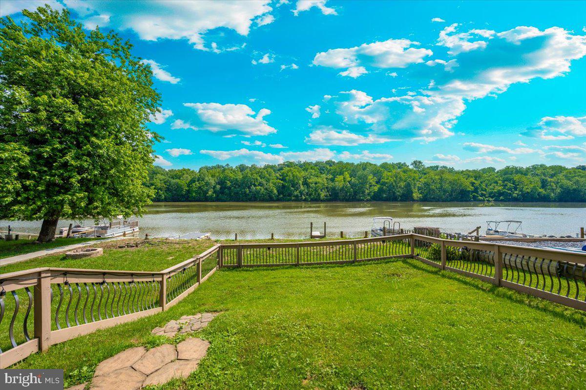 9 Boo Boo Boulevard Falling Waters, WV 25419 - Photo 4 of 40 a view of a swimming pool with a lake view