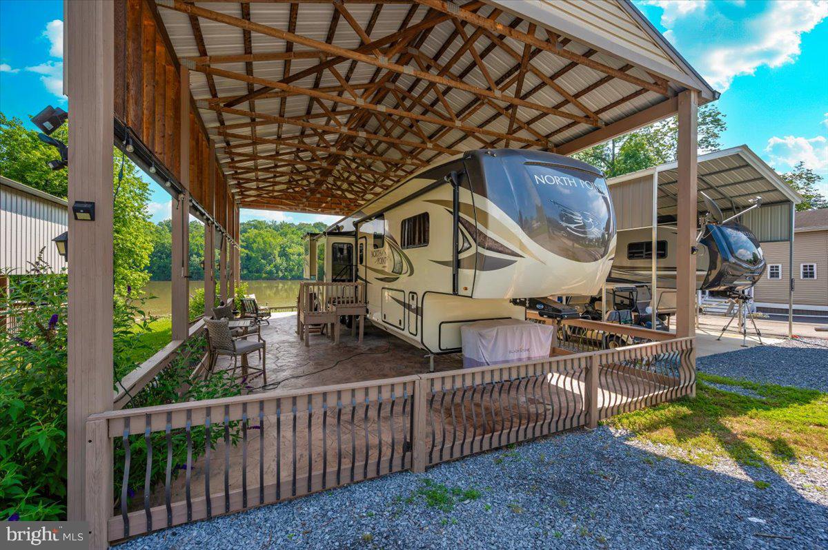 9 Boo Boo Boulevard Falling Waters, WV 25419 - Photo 6 of 40 a view of a house with wooden deck and furniture