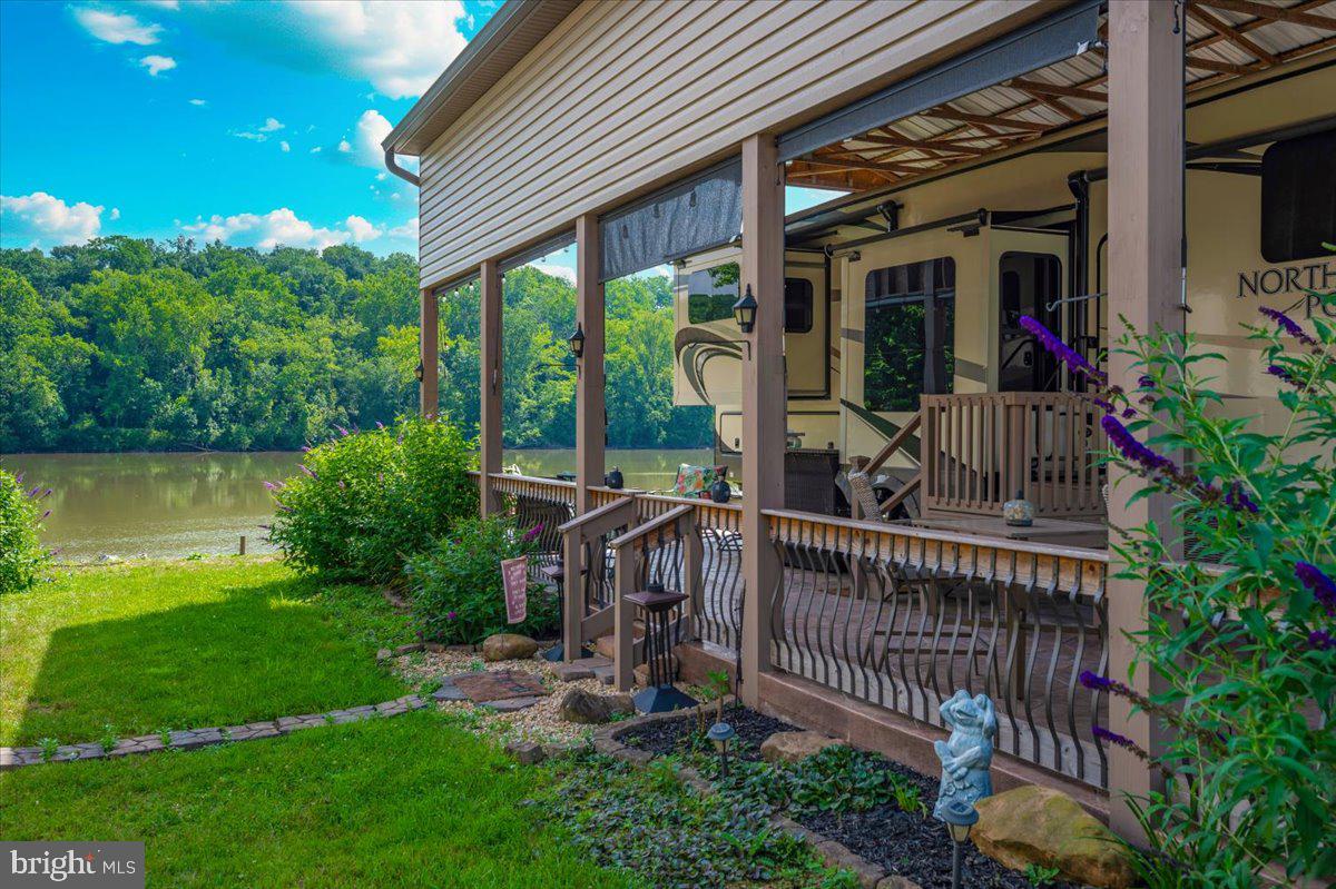 9 Boo Boo Boulevard Falling Waters, WV 25419 - Photo 7 of 40 a view of house with a yard and balcony
