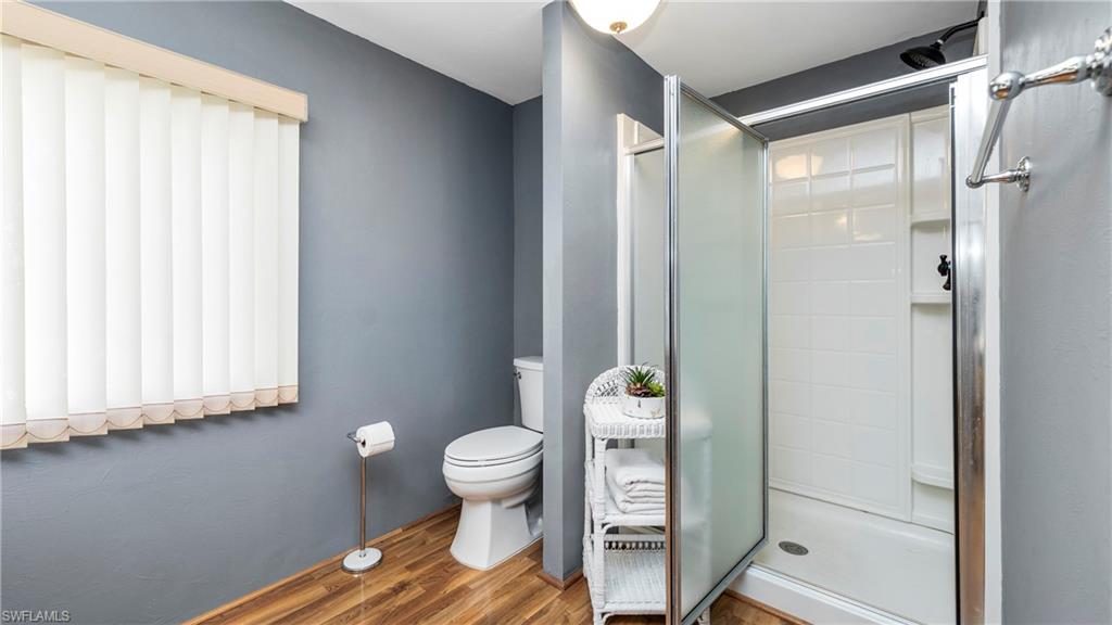 250 Indian Key Lane Naples, FL 34114 - Photo 18 of 33 a bathroom with a toilet and a shower