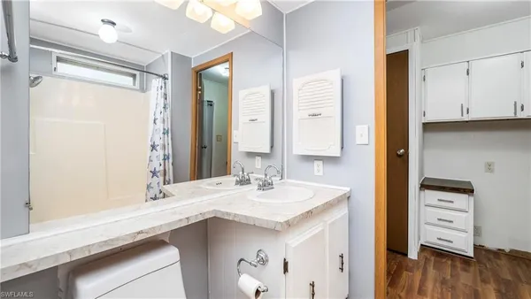 a bathroom with a sink and a mirror