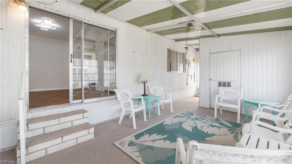 250 Indian Key Lane Naples, FL 34114 - Photo 23 of 33 a living room with furniture and a table
