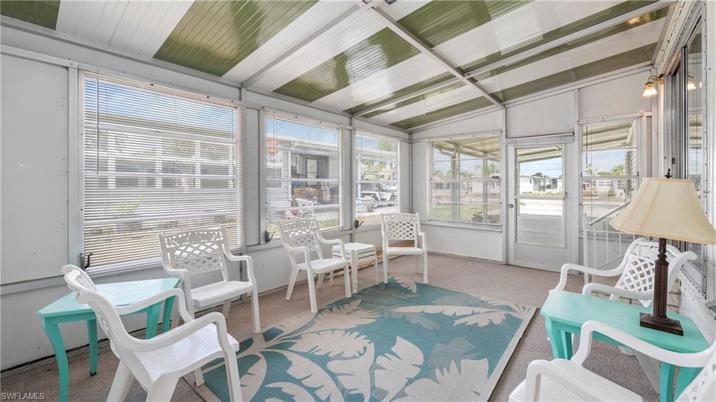 250 Indian Key Lane Naples, FL 34114 - Photo 24 of 33 a living room with furniture and a large window