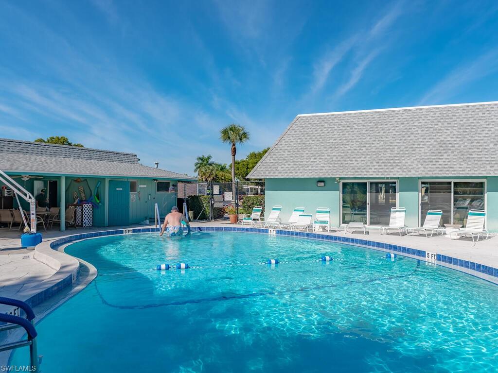 250 Indian Key Lane Naples, FL 34114 - Photo 28 of 33 front view of house with a yard
